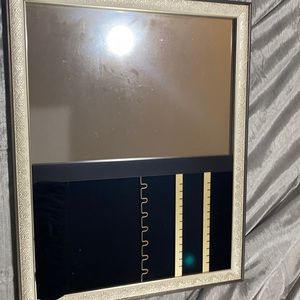 Mirror that holds jewelry